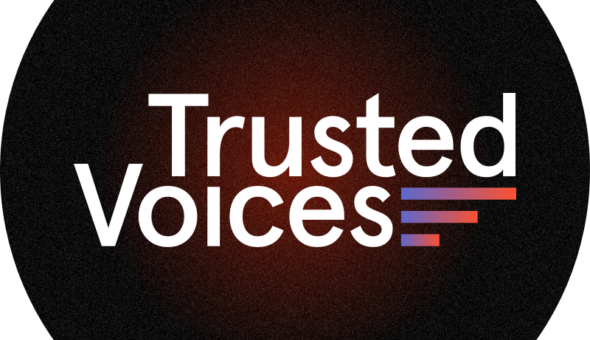 A graphic design with a black background that gets slightly orange in the center; in the middle of the image are two words: 'Trusted Voices,' with three horizontal bars next to those words that gradually change in color from purple on the left to orange all the way on the right.