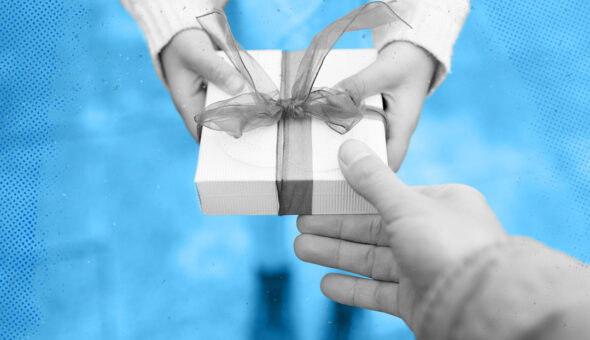 Two people exchanging a gift