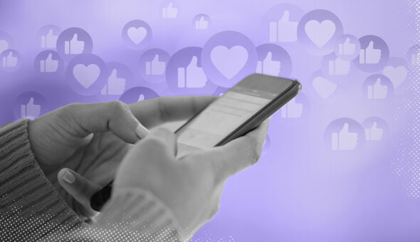 Image of hands typing on smartphone, social media likes floating in the light purple background.