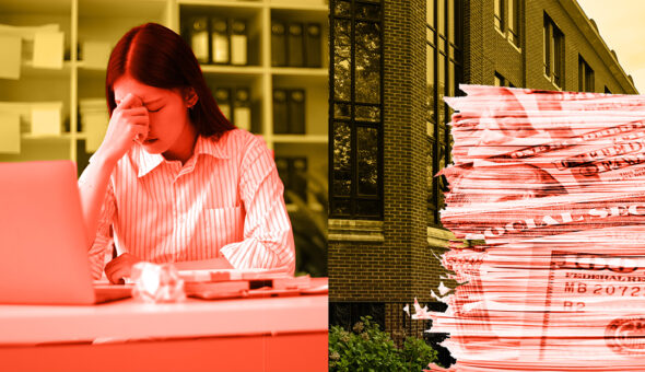 An image of a young woman with dark hair hanging her head in frustration while working on a computer. To the side a stack of FAFSA forms is piled.