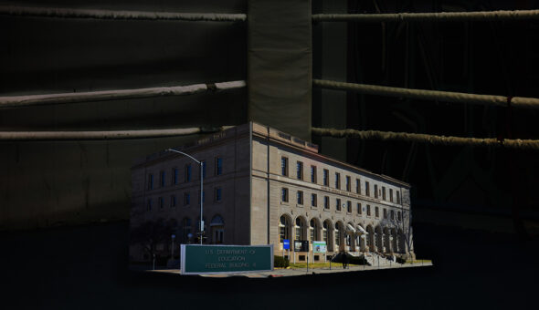 The Senate just confirmed Linda McMahon as DOE Secretary. What’s next? article image. A digitally manipulated image featuring the U.S. Department of Education Federal Building placed inside a dark boxing ring. The ropes of the ring surround the building, creating a visual metaphor for conflict. The lighting emphasizes the contrast between the brightly lit government building and the shadowy, worn-down boxing ring.