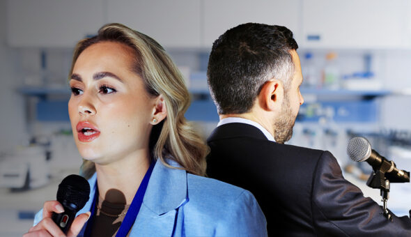 Who Gets to Speak for Science article image. A woman in a blue blazer speaks into a microphone, facing forward with a serious expression, while a man in a dark suit stands with his back turned, also facing a microphone. The background shows a blurred laboratory setting, highlighting a contrast between public speaking and scientific environments.